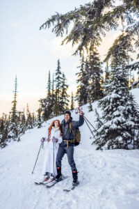 Man and woman skiing and cheering