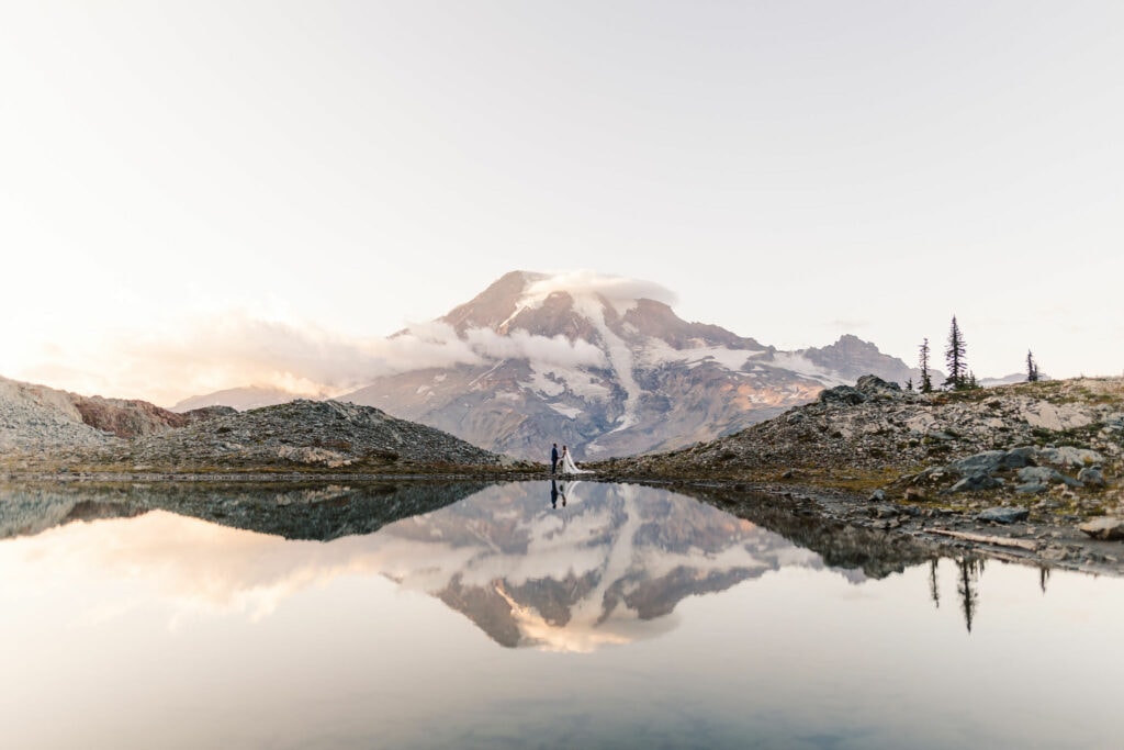 a landscape-oriented photo of bride and groom at their mt rainier elopement wedding